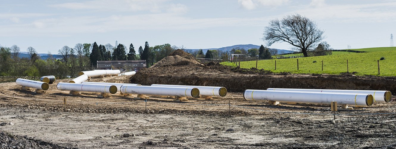 EMC Constuction site with pipes fisher german banner